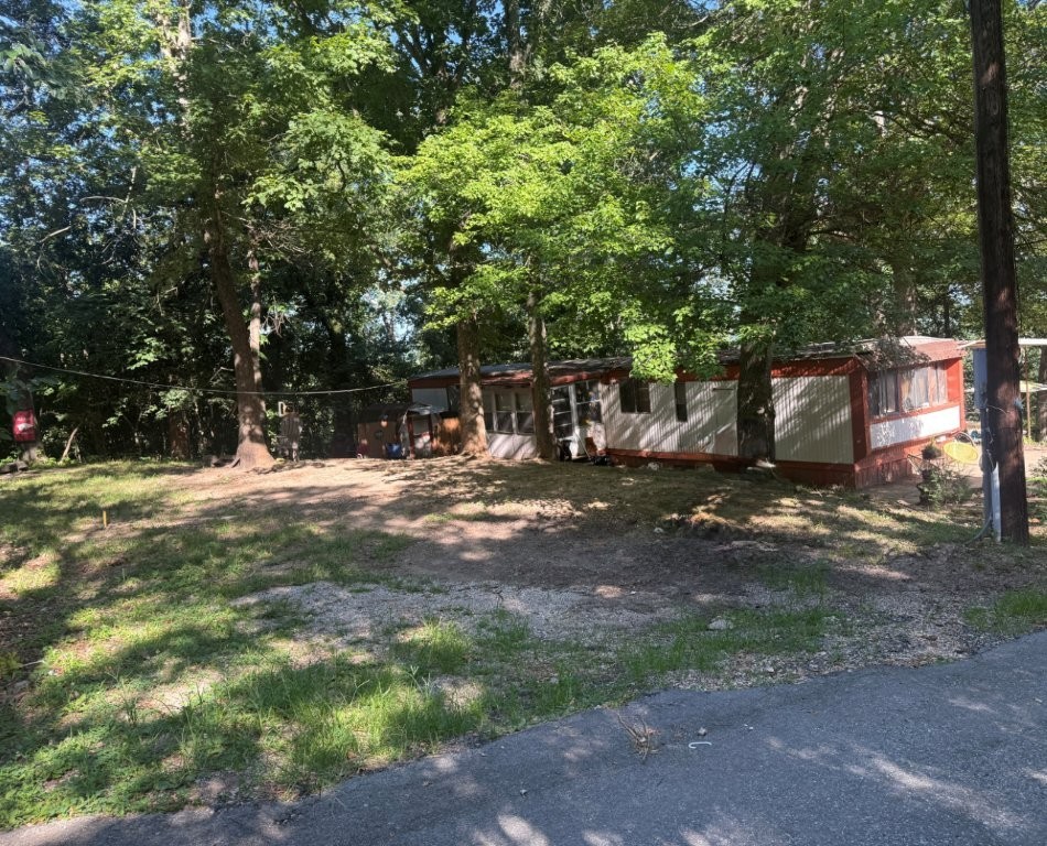 Mobile home in great location close to Mountain Biking Trails, the new OZ Trails Bike Park w/chair lift, Blowing Springs, Mercy, Business. Home is currently tenant occupied. Sold AS IS. Seller has never occupied home. It will not go secondary financing.