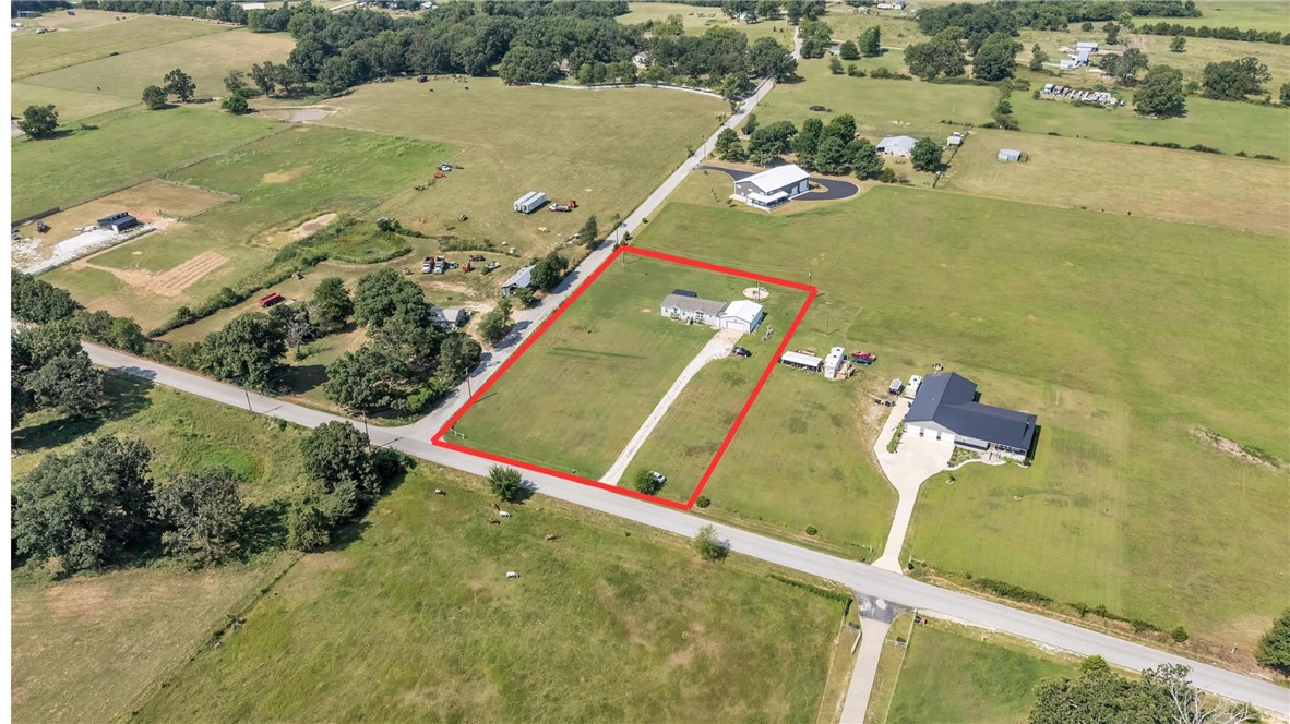 Enjoy peaceful country living on 2.04 flat acres in Garfield! This 3-bedroom, 2-bath home was newly completed in 2020 and offers modern comfort in a quiet rural setting. A 30x40 shop sits just steps away with a covered walkway connecting it to the houseāand includes a built-in storm shelter for added safety. Relax on the covered back deck and take in the open skies and serene surroundings. Plenty of room for goats, chickens, or gardeningāyes, theyāre welcome here! A perfect blend of space, functionality, and country charm.