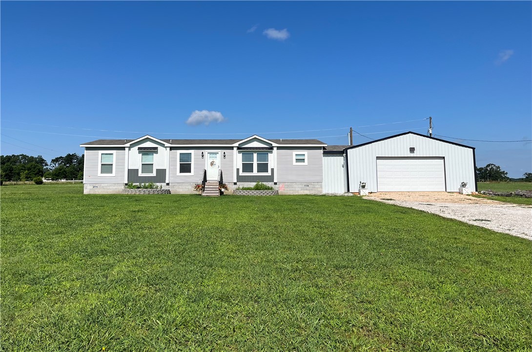 Enjoy peaceful country living on 2.04 flat acres in Garfield! This 3-bedroom, 2-bath home was newly completed in 2020 and offers modern comfort in a quiet rural setting. A 30x40 shop sits just steps away with a covered walkway connecting it to the houseāand includes a built-in storm shelter for added safety. Relax on the covered back deck and take in the open skies and serene surroundings. Plenty of room for goats, chickens, or gardeningāyes, theyāre welcome here! A perfect blend of space, functionality, and country charm.