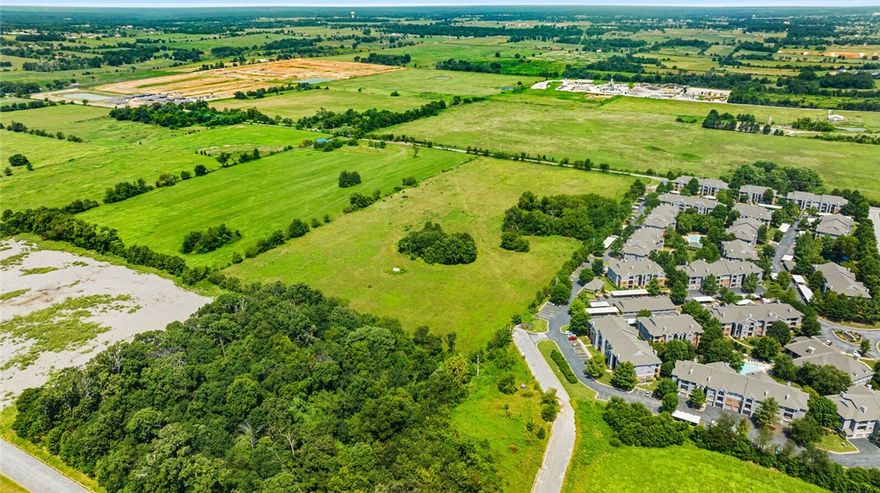 This 20-acre tract on Vaughn Road is positioned in Centerton’s fastest-growing corridor! Prime frontage with immediate access to SW Regional Airport Blvd, which carries over 11,000 vehicles daily. Just 5 minutes to XNA and 15 to I-49. Zoned R-2, ideal for duplex or two-family residential development that serves as a transition between single-family and higher-density housing in one of the most in-demand markets in Northwest Arkansas. Water line at the street and sewer approximately 2,100 feet west. Primarily open land with minimal trees allows efficient site planning. Surrounded by new residential communities, retail growth, and major infrastructure investment. This location offers the visibility, access, and momentum developers need to move quickly and maximize returns.