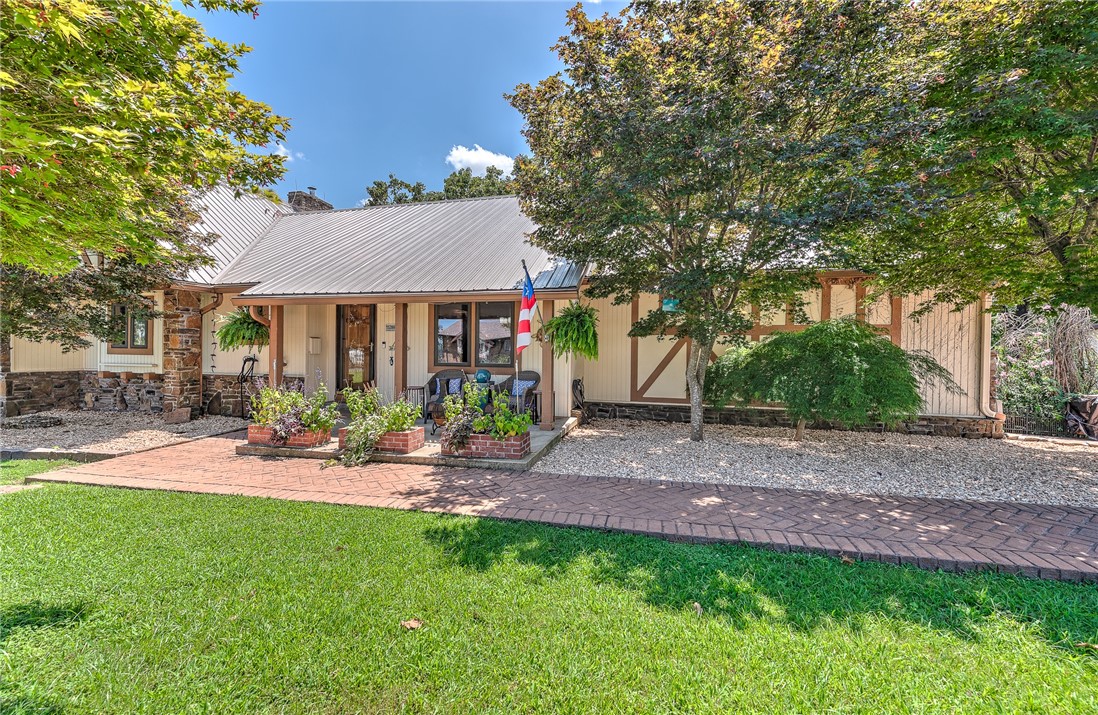 Immaculately Maintained & Updated Beaver Lake Area Home with Seasonal Views & Outdoor Oasis. Beautiful, updated 4-bed 3-bath home nestled in a peaceful lake area community above Prairie Creek. The charming, spacious & inviting layout is perfect for both relaxation and entertaining. Enjoy your morning coffee in the stunning sunroom, offering tranquil views of the beautifully landscaped & wooded backyard & serene koi pond. Step downstairs to a private outdoor entertainment area & hot tub on the large deck & a separate stone patio w/electricityāperfect for gatherings, grilling, or cozy nights under the stars. Inside, you'll find tasteful updates throughout, combining modern comfort with timeless appeal. 2nd primary bed & bath upstairs. Downstairs, a finished, heated & cooled basement room makes the perfect space for a home gym, hobby room, or private retreat (not included in sq ft). Donāt miss this rare opportunity to own a well-cared-for home in a coveted location that blends peaceful nature with practical amenities.