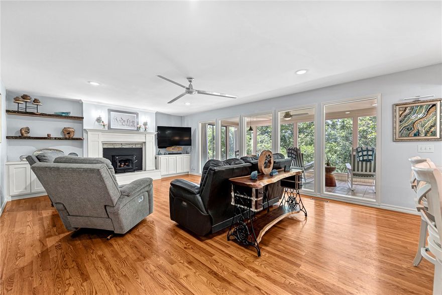 Immaculately Maintained & Updated Beaver Lake Area Home with Seasonal Views & Outdoor Oasis. Beautiful, updated 4-bed 3-bath home nestled in a peaceful lake area community above Prairie Creek. The charming, spacious & inviting layout is perfect for both relaxation and entertaining. Enjoy your morning coffee in the stunning sunroom, offering tranquil views of the beautifully landscaped & wooded backyard & serene koi pond. Step downstairs to a private outdoor entertainment area & hot tub on the large deck & a separate stone patio w/electricity—perfect for gatherings, grilling, or cozy nights under the stars. Inside, you'll find tasteful updates throughout, combining modern comfort with timeless appeal. 2nd primary bed & bath upstairs. Downstairs, a finished, heated & cooled basement room makes the perfect space for a home gym, hobby room, or private retreat (not included in sq ft). Don’t miss this rare opportunity to own a well-cared-for home in a coveted location that blends peaceful nature with practical amenities.