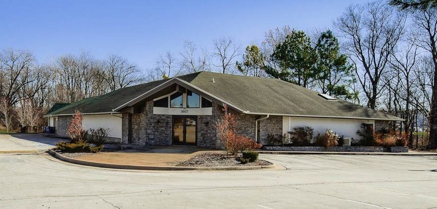 Conference room, open floor plan, and dock door. High traffic area.Conveniently located close to Walton Blvd, Walnut Street, and I-49. Zoned C-2 and situated on 1.65 Acres. This building has been beautifully finished out in 2012 with a contemporary flare. A beautiful, large deck, a bar, high beamed ceiling with custom lighting. Great for entertaining!