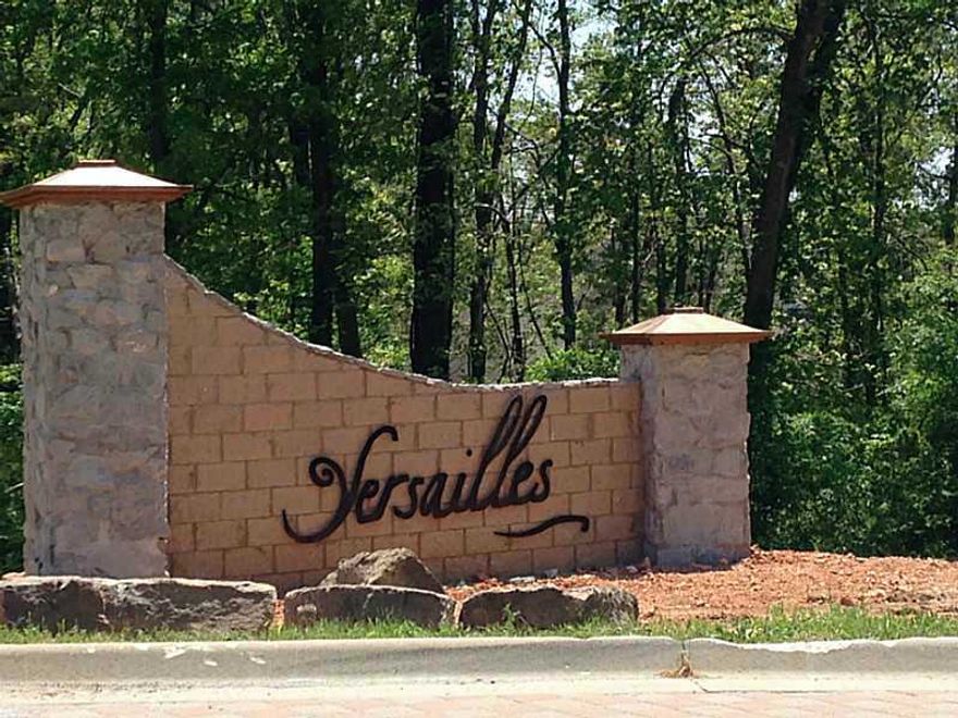 The rejuvenation is beginning in Versailles -- are you looking for a secluded and private neighborhood with lots ranging from 1 -- 4 acres to build your dream home? Beautiful home sites nestled on over 219 acres of wooded rolling hills - location is,excellent - a short 3 miles to WalMart GO and within Bentonville school district; yet feels like a world away from the hectic daily life. Min. build is 3500 sq.ft. with covenants and restrictions. Several sites are great for walk out basements too!
