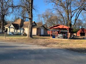 Seller has reduced the sales price to offset the cost of some of the repairs. The new owner will own the entire Block. Buyer could have a new roof, new windows and new siding all the way around the house for under 10k per estimate provided to seller.Nice Barn with Stalls that could easily be converted to a shop!Seller has done most of the hard work.All thats left is to move in and finish it up and reap the rewards!!Seller has updated plumbing, electrical, faucets,tub,shower,commode,sheetrock,flooring, hot water heater and more. No Restrictions!