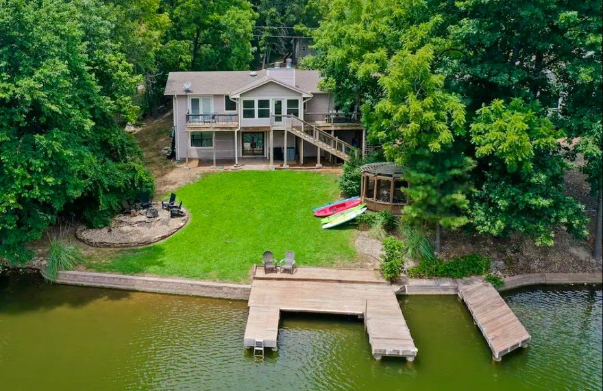 Lakefront property doesn’t get any better, level yard to the lake, 2 boat slips. This Charming farmhouse style home had many updates and is fully furnished. Home is a successful working nightly rental, all furniture and future nightly booking to convey if wanted. You don’t want to miss out on this one. Located just across from Tiree Park and minutes away to Hiwasse and I – 49. Call listing agent for all appointments.