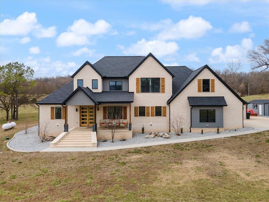 Experience this elegant estate located on 7.34 acres near Beaver Lake. This home offers comfort, convenience, and elegant living. The living room and kitchen space with large windows allow the natural lighting to flow in to this impeccable space. A massive bonus room is perfect for a home gym and large game room. The luxurious primary suite highlighted by trey ceilings and beautiful crown trim with access to the outdoor space. The master bath features a soaker tub, double vanity, full tile shower, and a large closet with built in shelving. The outside oasis offers entertaining space with a covered patio with fireplace, a designated hot tub area, a sport court, a 18x36 gunite UV Ozone/Chlorinated pool with a 8x10 tanning shelf with jetted water and LED lighting and a gas enabled fire pit. All of this and so much more just minutes from town and from the lake. See the attached list of additional amenities. Call today for your private showing of the place that you will love to call home!