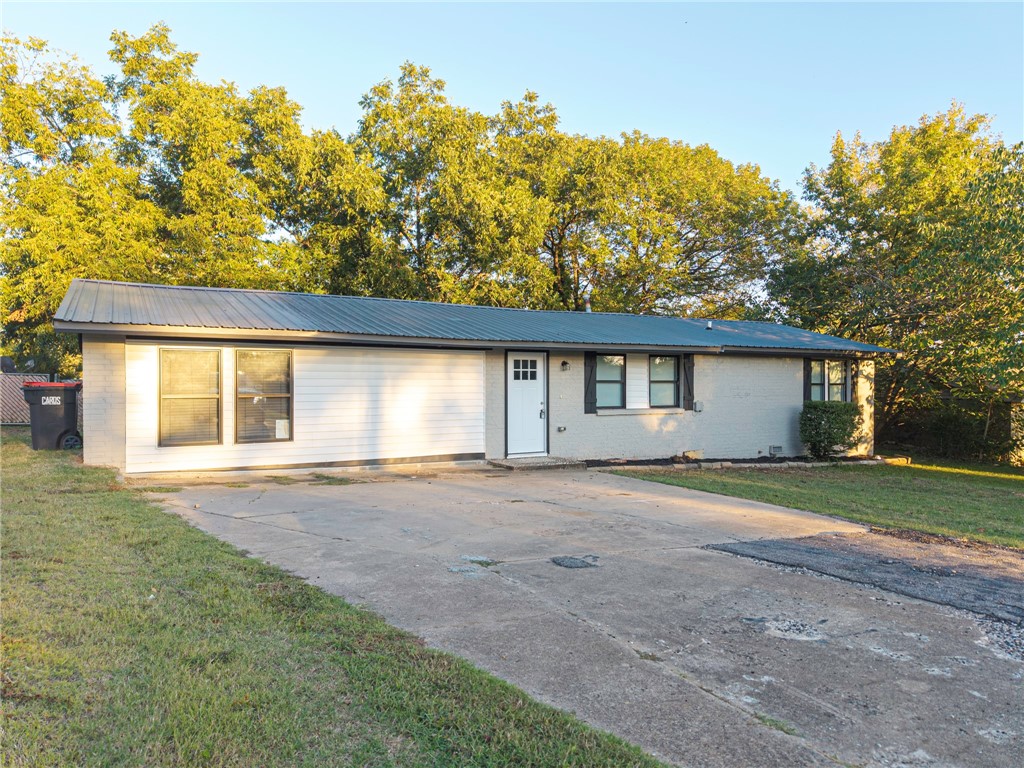 This home has been completely remodeled from top to bottom with all- new everything including vinyl windows. It features: 3 bedrooms, a flex room & 2.5 bathrooms. The kitchen boasts an open floor plan with brand-new cabinets, granite countertops, and stainless steel appliances. New HVAC in 2023. A newly added large master suite that includes a bathroom with a tub, double sinks, and a walk -in tiled shower. Other highlights include a tankless hot water heater, a metal roof, and light grey painted brick for a modern touch. Situated on a corner lot with a chain link fenced backyard. Just minutes from Springhill Park and local restaurants.