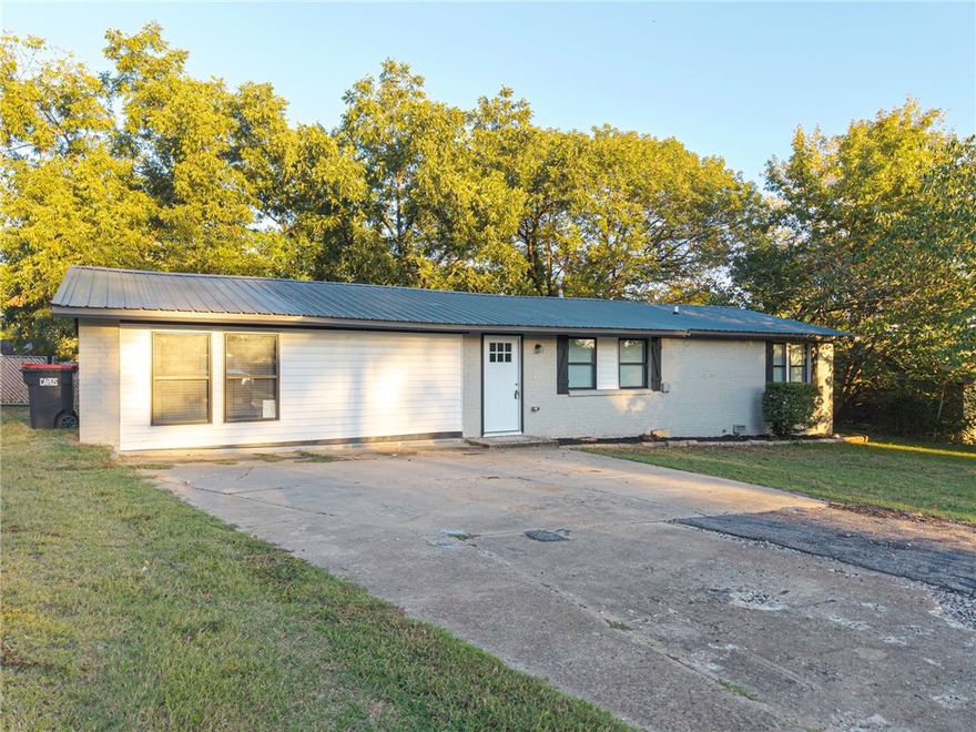 This home has been completely remodeled from top to bottom with all- new everything including vinyl windows. It features: 3 bedrooms, a flex room & 2.5 bathrooms. The kitchen boasts an open floor plan with brand-new cabinets, granite countertops, and stainless steel appliances. New HVAC in 2023. A newly added large master suite that includes a bathroom with a tub, double sinks, and a walk -in tiled shower. Other highlights include a tankless hot water heater, a metal roof, and light grey painted brick for a modern touch. Situated on a corner lot with a chain link fenced backyard. Just minutes from Springhill Park and local restaurants.