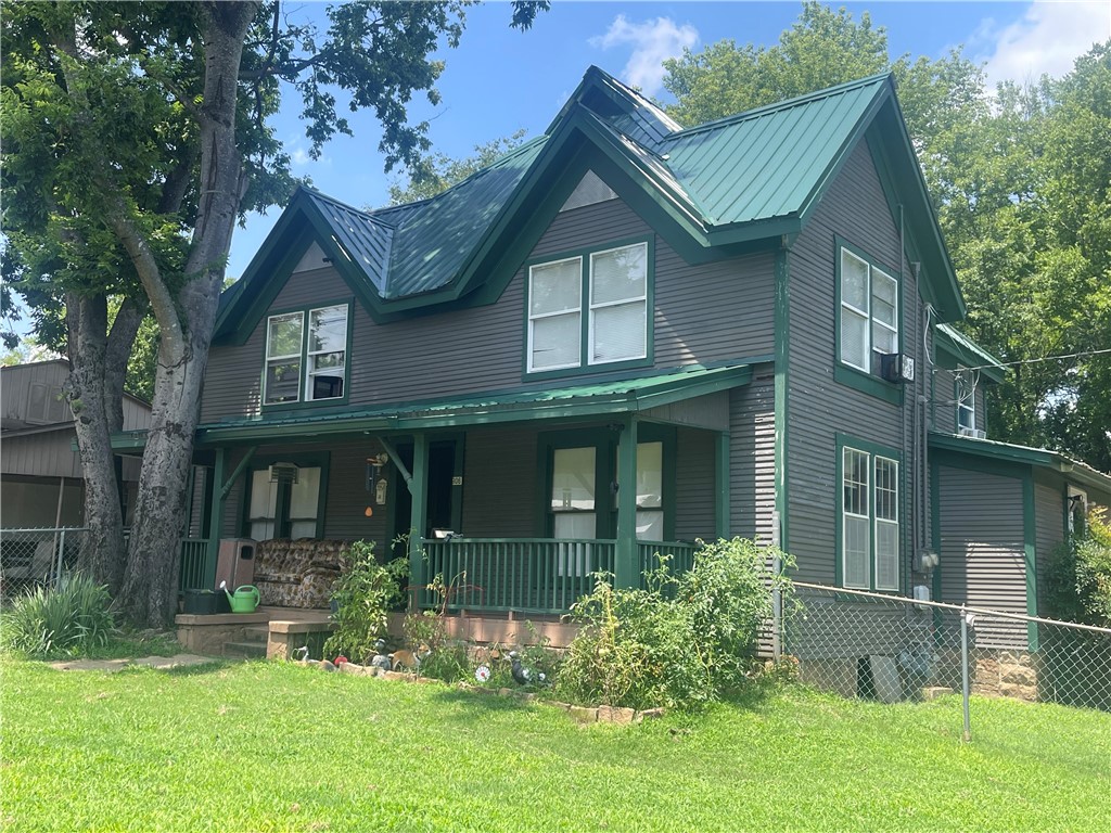 ENDLESS POSSIBILITIES PROVIDED IN THIS 2 STORY, TIMELESS HERITAGE. Offering columned porches, various entrances, and steep roof lines. Alluring, vintage details shine in the many rooms. Some updates have been completed, others are in progress. Sells "as is" condition. The lower level has 1.5 baths, one bedroom, 1 living room, cute, spacious kitchen, loads of closets. The upper level has been totally remodeled and offers a living room, kitchen, 2 bedrooms, 1 bath. There is an extra, unfinished laundry room downstairs. Almost a half acre yard offers plenty of room for parking and outside entertainment. The downstairs level has a large "eat in" kitchen with a couple of small, versatile, bonus rooms close by. Beautiful detailing from yesteryear can be found throughout this voluminous house. Listing can only be viewed daily AFTER 2:00 in the afternoon. No exceptions. Full 24 hour notice.