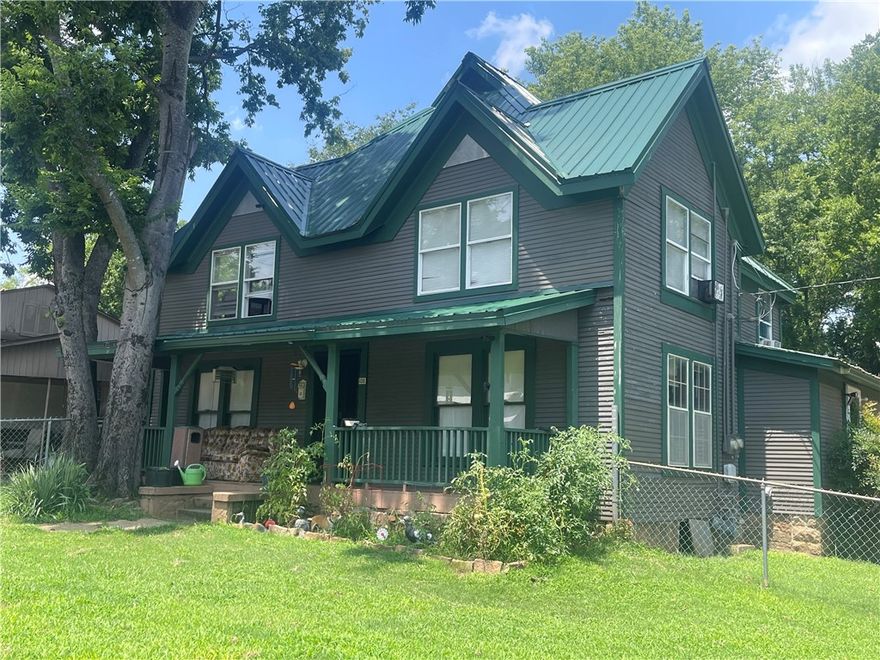 ENDLESS POSSIBILITIES PROVIDED IN THIS 2 STORY, TIMELESS HERITAGE. Offering columned porches, various entrances, and steep roof lines. Alluring, vintage details shine in the many rooms. Some updates have been completed, others are in progress. Sells "as is" condition. The lower level has 1.5 baths, one bedroom, 1 living room, cute, spacious kitchen, loads of closets. The upper level has been totally remodeled and offers a living room, kitchen, 2 bedrooms, 1 bath.  There is an extra, unfinished laundry room downstairs. Almost a half acre yard offers plenty of room for parking and outside entertainment. The downstairs level has a large "eat in" kitchen with a couple of small, versatile, bonus rooms close by. Beautiful detailing from yesteryear can be found throughout this voluminous house.  Listing can only be viewed daily AFTER 2:00 in the afternoon. No exceptions. Full 24 hour notice.