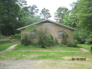 This property contains two Homes and a building previously used as a Gift Shop......Main house is the 15 Solar Lane address, #9 is the Guest House......Sellers offering property in the ''AS IS'' condition....MLS Detail printout is for the main house only...Guest House has one bedroom, one bath, living room, kitchen area and an extra room for any use you might need or want...Guest house is 1130 SQ foot Heated and cooled area....The previous Gift Shop is 23 x 49 (1127) All this on 7.46-acres......The fourth bedroom is part of a Mother-in-law Quarters at one end of the house....other three bedrooms are on the other end...this part has kitchen..