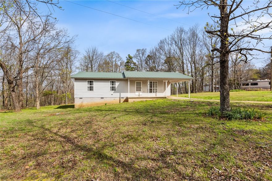 Tucked away at the end of a quiet dirt road, this charming home offers the perfect blend of
privacy and convenience on 1.74 M/L acres in scenic Newton County. Featuring 1,092 M/L
square feet, this 3-bedroom, 2-bathroom home is ideal for those looking to enjoy the
peaceful beauty of the Ozarks while still being just a short 10-minute drive from Jasper.
The home has a metal roof and an attached 1-car carport for added convenience. Step out
back and take in the serene surroundings from the expansive covered deck that stretches
the full length of the home—perfect for relaxing, entertaining, or enjoying your morning
coffee while soaking in the natural setting.
Whether you're searching for a full-time residence, weekend getaway, or investment
opportunity, this property offers comfort, privacy, and a prime location near the Buffalo River
and all that Newton County has to offer