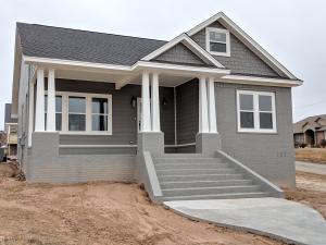 NEW CONSTRUCTION! This is a beautiful craftsman style home with plenty of charm and space. Painted brick, hardy board siding for long life with cedar shakes in the eaves. Hardwood floors, granite countertops and 9 foot ceilings inside round out the look and feel of this home. Construction will be completed soon. Call for more details. **Columns and sidewalk are in. Added Pictures Of Kitchen and Extra Bedrooms**