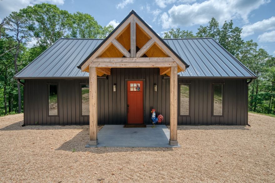 This property is your ticket to privacy! Located just off of the highway on it’s own gated driveway, this home was recently constructed and feels brand new! The surrounding 14 acres encompasses a rare, flat ridge top so you have room for future expansion or fun exploring in the woods! Two bedrooms downstairs and a loft bedroom let you sleep the whole family. Impressive ceiling height, granite counter tops, and stainless appliances make this a fun house to gather in. The covered back patio gives you a cozy place to escape the rain or an entertaining place to watch the game. This property has underground power, a private well, and spacious parking. Located very close to Beaver Lake and the White River but yet still has quick access to Eureka Springs!