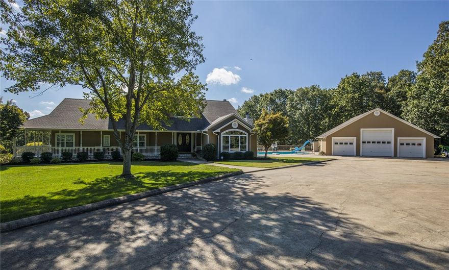 Peaceful oasis 10 minutes from town! Stunning Estate home sitting on 45+/- acres overlooking Beaver lake with ozark mountain views. Gourmet kitchen with Viking gas cooktop, double ovens, ice-maker. The large island gives plenty room for serving & work space. Main floor has 2nd master suite & 2 other bedrooms. Spacious master suite has its own floor. Walk out basement is a dream for entertaining with wet bar, media area, game room, exercise room and flex craft/ hobby room. Wrap around porch and two decks to sit, relax, and entertain guests. In ground Mineral gunite pool w/ automatic cover. 40x42 Garage/Shop area. Check out the video for a bird’s eye view of this amazing estate.