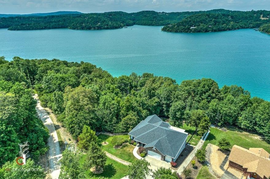 EXCEPTIONAL CUSTOM-BUILT LAKEFRONT SHOWSTOPPER W/ PRIVATE DOCK ON BEAVER LAKE!  Enjoy the most beautiful peninsulas on the East side of Beaver Lake in this stunning 2 level home featuring 2 master suites, large chef’s kitchen, wet bar, sunroom,  2 living areas, private study w/ custom built-ins, and 2 spacious levels of covered deck space overlooking the lake!  Huge walk-out basement features second living area w/ kitchenette, theater room w/ 104” screen & surround sound plus a murphy bed for overflow guests, exercise room, media room, second master and guest bedroom plus climate controlled walk-in storage space (20’ x 32’).  Huge enclosed outdoor shower on lower deck, new 40 year roof (2015), backup generator w/ 2 500 gallon propane tanks, water softener, new water heaters, new paint & flooring, plantation shutters & more!  Easy walk to 4 slip private composite dock w/ swim platform!  This fabulous lakefront home is IMMACULATE and can be your vacation or forever home!