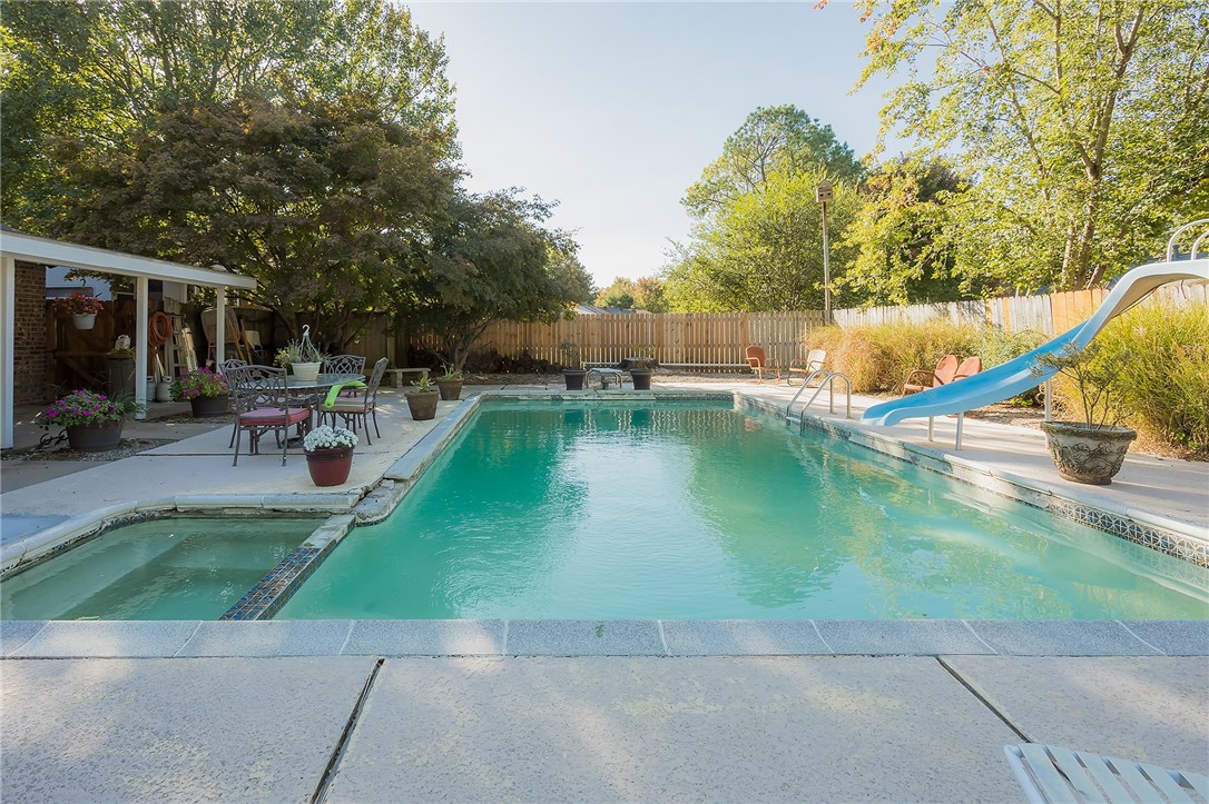 This excellent family home has tons of room with four bedrooms! The backyard has a giant in-ground pool and back porch, which makes this great for entertaining. There is a previous property inspection report available. The home has a new roof, new insulated windows, new wood flooring, and a remodeled kitchen with new appliances! The seller will provide a home warranty. The sellers have obtained a quoted price to repair the coping and tile in the pool. This amount will be credited at closing to a successful bidder. The swing does not convey. This property is located in the Turtle Creek subdivision and is central to all things Rogers has to offer.