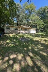 Do you want a piece of West Fork history? This lot has a natural spring running down the north side and a rock milk house in the back. 3 bedrooms 1.5 baths. Windows replaced 15 years ago. New roof. Needs floor covering. Will not go FHA, VA or RD.