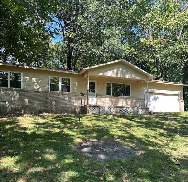 Do you want a piece of West Fork history? This lot has a natural spring running down the north side and a rock milk house in the back. 3 bedrooms 1.5 baths. Windows replaced 15 years ago. New roof. Needs floor covering. Will not go FHA, VA or RD.