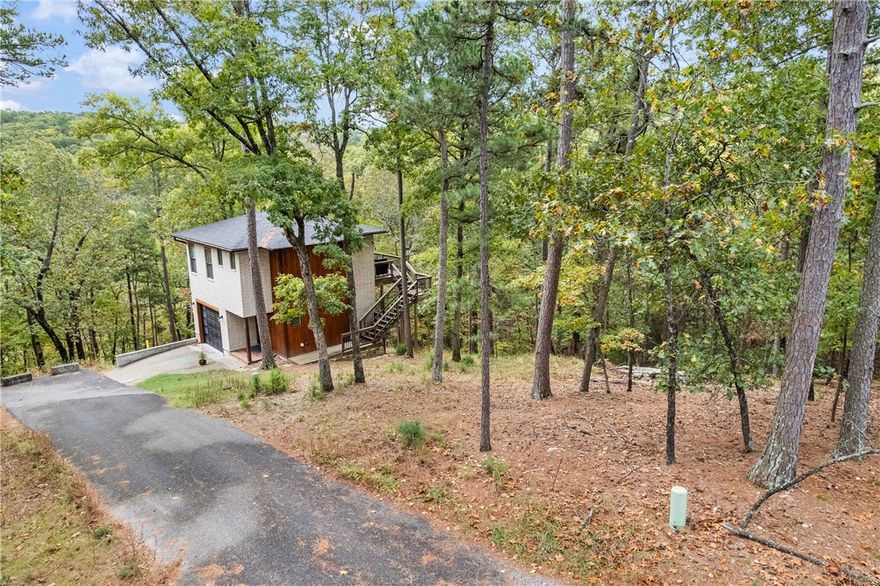 RARE opportunity in Eureka Springs’ Historic District! Gorgeous lot on a peaceful, low-traffic street surrounded by beautiful modern homes. All utilities are already connected—ready for your dream build. Enjoy the best of both worlds: the charm and character of the Historic District without the noise or traffic. From this private, tucked-away location, you’re just minutes from downtown shops, dining, events, and the highway. Stunning views and natural beauty create the perfect setting for your future home. Whether you’re planning a vacation getaway or a place to retire, this property offers a unique chance to build new in one of Eureka’s most desirable, hidden locations. Opportunities like this don’t come often in Eureka Springs, don’t miss your chance to make it yours.