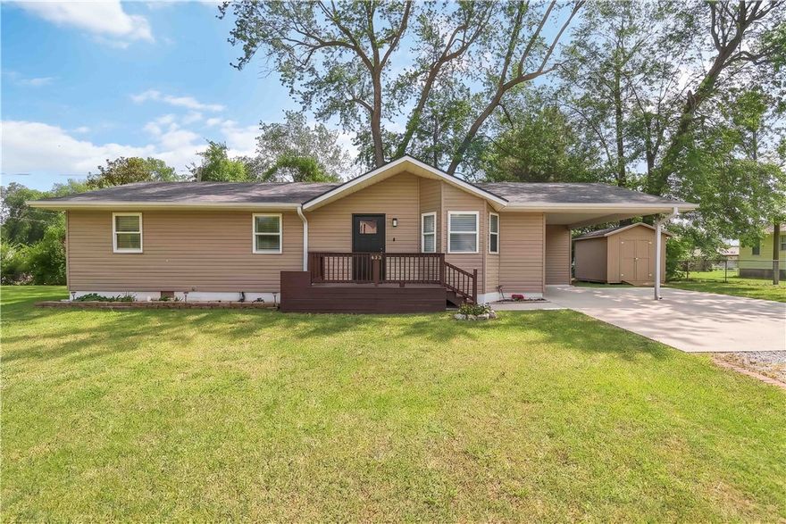 Completely updated ranch-style home situated on a spacious corner lot in the heart of Centerton. This 3-bedroom, 2-bath home showcases modern finishes throughout, including luxury vinyl plank flooring, new carpet, and fresh interior paint. The kitchen is designed for both style and function with granite countertops, soft-close cabinetry, and a full suite of appliances including a gas range. The inviting living area features a beautifully updated fireplace, creating a warm focal point. Major system updates include roof (2021), water heater (2022), ductwork (2020), and HVAC (2018), offering peace of mind. Step outside to enjoy a large deck, mature trees, and a powered storage building. Conveniently located within walking distance to parks, shops, restaurants, and local favorites like Marrs Mercantile, this home combines modern updates with an unbeatable location.