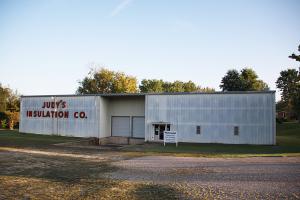 Commercial building with 308' of Hwy 62/412 frontage. 7290 SF steel frame /insulated, metal roof, metal siding, 2 large covered overhead doors,loading dock, offices, kitchen, show room, 2nd level storage, large parking area, skylights, on 1.56 AC. Can be used for a variety of businessopportunities, great location for easy access and close to amenities. The possibilities are endless and plenty of room for expansion.