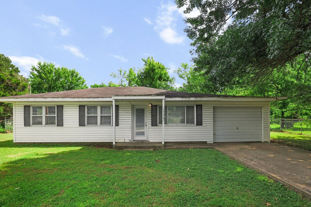 This 4 bed/1 bath property offers practical living space with recent updates in an excellent location near the University of Arkansas. The home features a converted garage bedroom, double-pane metal windows throughout, and mixed flooring including LVP, ceramic tile, and carpet. The kitchen boasts butcher block countertops, a gas range, and dishwasher. A spacious backyard with chain link fence provides excellent outdoor space. Each of the 3 main bedrooms include ceiling fans and LED lighting. Additional features include an asphalt shingle roof and backyard fireplace. The property is positioned just steps from the UofA and downtown Fayetteville, with easy access to the Dickson St entertainment district. Outdoor enthusiasts will appreciate the proximity to the 40-mile Razorback Greenway trail system and Fayetteville's nearly 100 miles of trails. Currently tenant-occupied by college students, this property presents an investment opportunity with immediate rental income potential in this vibrant university community.