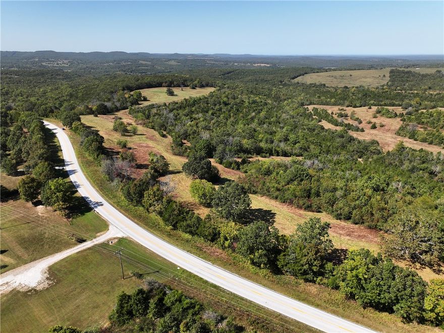 Incredible opportunity to own 230 acres with nearly half a mile of Highway 14 frontage just outside Lead Hill, AR. This versatile property offers rolling hills, scenic ridges, elevations from 1,000–1,400 ft, and multiple homesites with breathtaking views. The land features open pasture, hardwood forest, three ponds, and wet-weather creeks, making it ideal for development, recreation, or a private retreat. Conveniently located only 9 miles from Lead Hill, 21 miles from Harrison, 27 miles from Branson, and just 4.5 miles from Bull Shoals Lake and Tucker Hollow, this property combines seclusion with accessibility. Perfect for retirement, investment, or building your dream home in the Ozarks—mobile homes permitted.