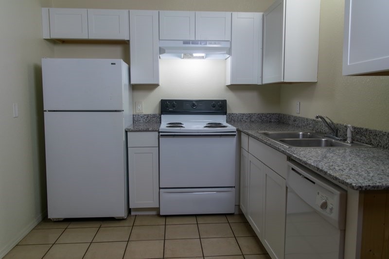 Great Fayetteville apartment located just minutes from shopping, restaurants, walking trail and university. Vinyl plank and tile throughout unit. Full-sized refrigerator, electric range, garbage disposal and dishwasher and beautiful white cabinetry. Stackable washer/dryer. Walk-in closet. Shower/tub combo. Downstairs unit in 6-plex. All electric unit. Tenant pays electric only. Water/trash included in rent.