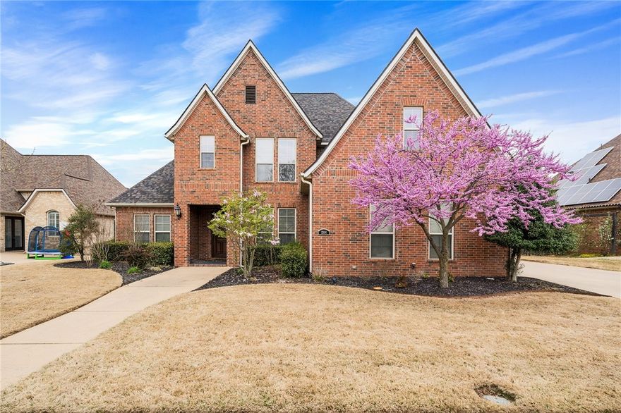 Luxury home located in Turnberry at The Peaks between Pinnacle Promenade and Rogers High School. Main floor includes a master suite, master bath with tile shower, double vanity and whirlpool tub, walk-in closet, formal living room, formal dining room, office, second living room, second bedroom, and second full bath with exterior entrance to backyard deck. The large kitchen has granite counter tops, an island, ample storage, gas cooktop, and walk in pantry. Cozy second living room area off the kitchen has a gas fireplace. Upstairs has two bedrooms, two bathrooms and a bonus room. Mudroom has a sink and cabinets. Sprinkler system in the front and back yard. Enjoy a full deck that is accessible from the kitchen, master bedroom and downstairs second bath overlooking a spacious backyard. Private community pool.