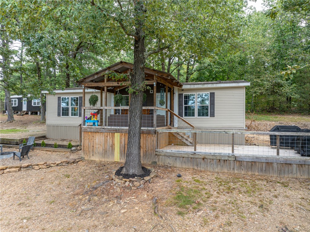 Welcome to peaceful country living in Cedarville! This charming 3-bedroom, 2-bath mobile home, built in 2016, sits on nearly 2 acres of serene land. A cozy covered front porch with ceiling fan invites you to relax and take in the quiet surroundings. Inside, the home has been tastefully updated with new vinyl flooring in the living room and kitchen, a stylish built-in electric fireplace, and new stainless steel appliancesāincluding a refrigerator. The kitchen features a butcher block island and pantry, with a convenient mudroom nearby. The spacious master suite boasts a walk-in closet and a master bathroom with an attached laundry area for added convenience. Outside, enjoy evenings around the fire pit or work on projects in the workshop/shed equipped with electricity. This property offers the perfect blend of comfort, functionality, and country charmāready for you to call home!