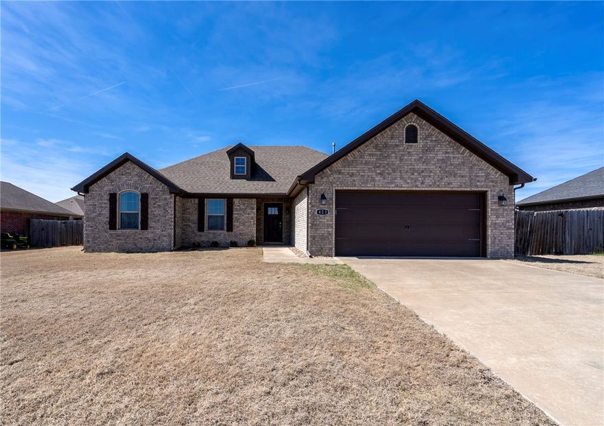 Back to the market at no fault of sellers! Buyers could not obtain financing. Meticulous 4 bd, 2 ba home located only 16 minutes from Fayetteville & U of A campus! 1720sf maintenance free all brick exterior. Open concept design. Living room features a corner gas fireplace; kitchen has granite counters & stainless-steel appliances. Wood flooring as you enter & in LR, tile in the wet areas, carpet in bedrooms. Primary ensuite has double sinks, &  walk-in shower before it leads you into your large closet. Added/upgraded lighting in all closets. Additional storage in utility, 2 car garage with attic storage. A covered porch with an extended living area of an added deck is perfect for entertaining in the privacy fenced backyard. Vivint security system with recently upgraded panel is owned & will be conveyed to buyers.