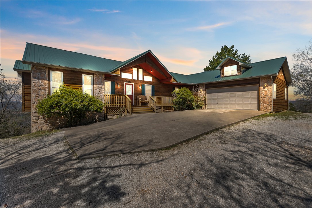 Incredible opportunity to own a thriving hospitality property with panoramic views of the White River and Ozark Mountains. Can-U-Canoe offers 17 fully furnished guest lodgings, including 11 cabins and 6 private suites across 20.96 acres. Units range from cozy 1BR to spacious 5BR accommodations, with full kitchens, covered decks, and 8 private hot tubs. Most units feature washers/dryers, granite counters, and custom built furniture. All units have unparalleled views of the White River and surrounding landscapes. Sale includes all furnishings, linens, supplies, hot tubs, grills, and maintenance equipment. Business assets include a professional website, online booking system, and 18+ years of VRBO/Airbnb history with loyal repeat guests. Plenty of parking to service all units. Located minutes from Eureka Springs and Beaver Lake, this property blends serene privacy with easy access to shopping, dining, and attractions. This is a rare turnkey investment with proven success and exceptional potential for future growth.