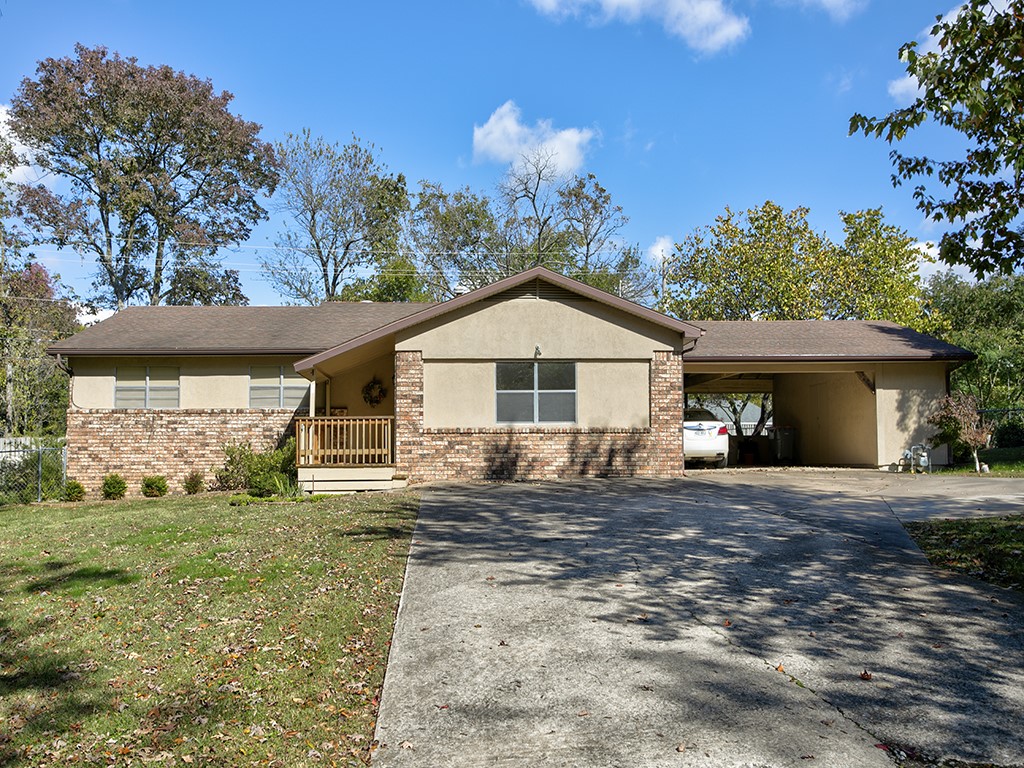 Charming 3 BR 2 BA home with 2-car carport in an established & highly desired neighborhood. This home features two living areas, extra large laundry & mudroom, nice eat-in kitchen w/ bay window & window seat, spacious bedrooms, gas log fireplace w/ stainless steel chimney & new blower, and a wonderful sunroom. There is plenty of space to enjoy the outdoors & entertain on the screened-in porch overlooking the beautifully landscaped, fully fenced back yard. Enjoy gardening in the separately fenced garden area with water spigot. Plenty of storage with a detached & attached shed. This home has been very meticulously cared for over the years, with updated insulation and electrical, and is ready for new owners to add their own touch. Move-in ready, or remodel as you see fit. Great location, just a short drive to Siloam Springs. Also very close to the new Siloam City Lake Park w/ walking & biking trails, fishing, disc golf, bird watching, & much more. Schedule a showing to see this lovely property today! To be sold as is.