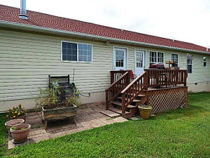 Like New 3BR, 2BA, home with 2 car garage, den, workshop, fenced yard, new wood floors, new appliances in the kitchen stay, garden shed, raised bed garden in back, nicely landscaped.