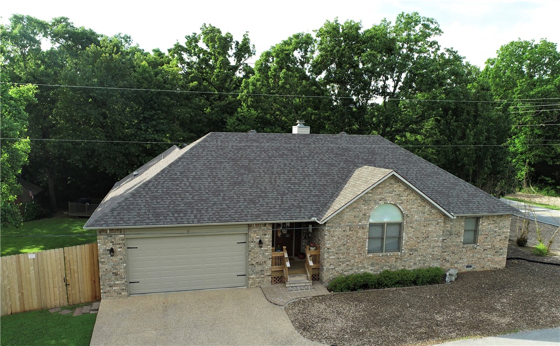 Impeccably maintained home in the heart of Bella Vista, just minutes to Loch Lomond and Branchwood Rec Center. This lovely 3/2 split bedroom plan home is on one level and features an open living room with fireplace, eat in kitchen and dining area. The back patio is perfect for enjoying outdoor dining under the pergola. The backyard is perfect for BBQs or just relaxing outdoors. Above ground pool is optional.Newer roof, new AC, new water heater. Additional lot offers over half an acre as well as rear privacy.