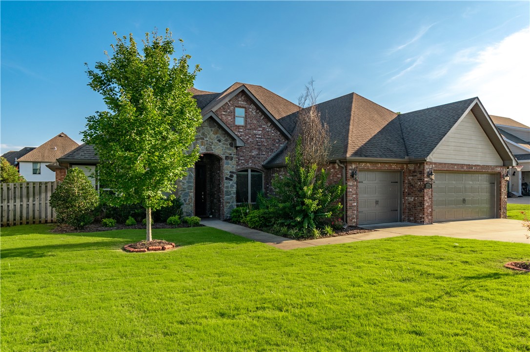 Stunning all brick and stone home in the in sought after Hughmount Village Subdivision! Home features a spacious open/split floor plan, large kitchen island, gas cooktop, built in oven and microwave, 4 bedrooms, office, 3 full baths, oversized master suite with own air conditioner, 3 car garage, huge covered patio, additional uncovered patio with pergola and wired for hot tub, fire pit area, front and back irrigation system, wired for electric vehicle charger, beautiful landscaping, and so much more! Neighborhood features a community pool, playground, and tons of green space! Easy commute to shopping, dining, U of A, i49, and all that Fayetteville has to offer!