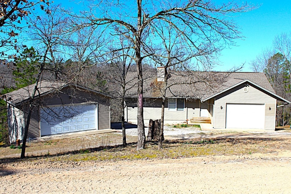 Tucked away in the quiet Ozark hills is a 5 bed 3 bath home on 4.46 acres with year-round lake views. It has an additional detached 2 car garage/shop/lake toy storage for your outdoor needs. Two level deck to enjoy the quiet yet close to a public boat launch and even the trails system. Plenty of room to 4 wheel or mountain bike.