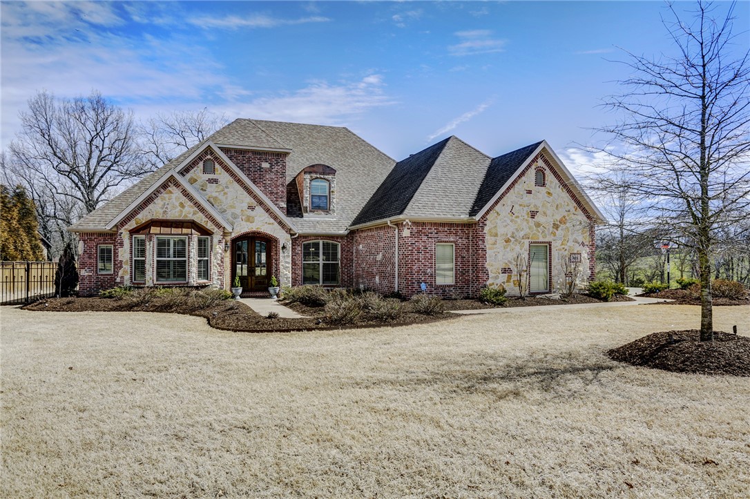 Beautiful custom home on 2 acres with amazing updates throughout. It offers quality, convenience and serenity in a wonderful neighborhood that is walking distance to Sassafras Winery. Located 10 minutes from Mission & Crossover. Amazing interior finishes with hardwood floors, granite, custom cabinets, tall ceilings and walk in closets. All new carpet upstairs. Backyard includes covered & uncovered stone patio and new gas fireplace, small iron fenced in area. A covered garden and pirate ship playset do convey.