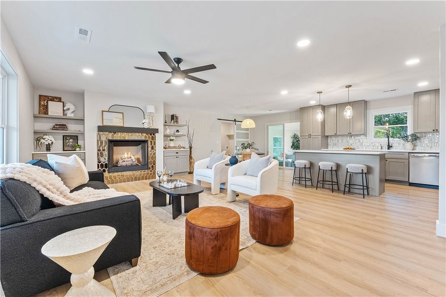 Welcome to 1201 NW 10th Street in Bentonville – a beautifully updated home ready for you to move right in! Step inside to an open-concept layout that connects the kitchen, dining, and living areas seamlessly. The kitchen shines with a spacious island, perfect for gathering or meal prep, plus a large pantry and adjacent laundry room for convenience. Enjoy year-round comfort in the heated and cooled sunroom, ideal as a second living space or home office. Recent upgrades include a one year old roof and recently installed HVAC and mini split system, giving you peace of mind for years to come. Outside, a brand-new deck extends your living space into the backyard, perfect for grilling, entertaining, or relaxing. Don’t miss this opportunity to own a move-in-ready home with a prime location that gives you easy access to world-class dining, shopping,  Mountain bike trails, and all that Bentonville has to offer! *New driveway that was poured will fit 2 vehicles beside each other.*