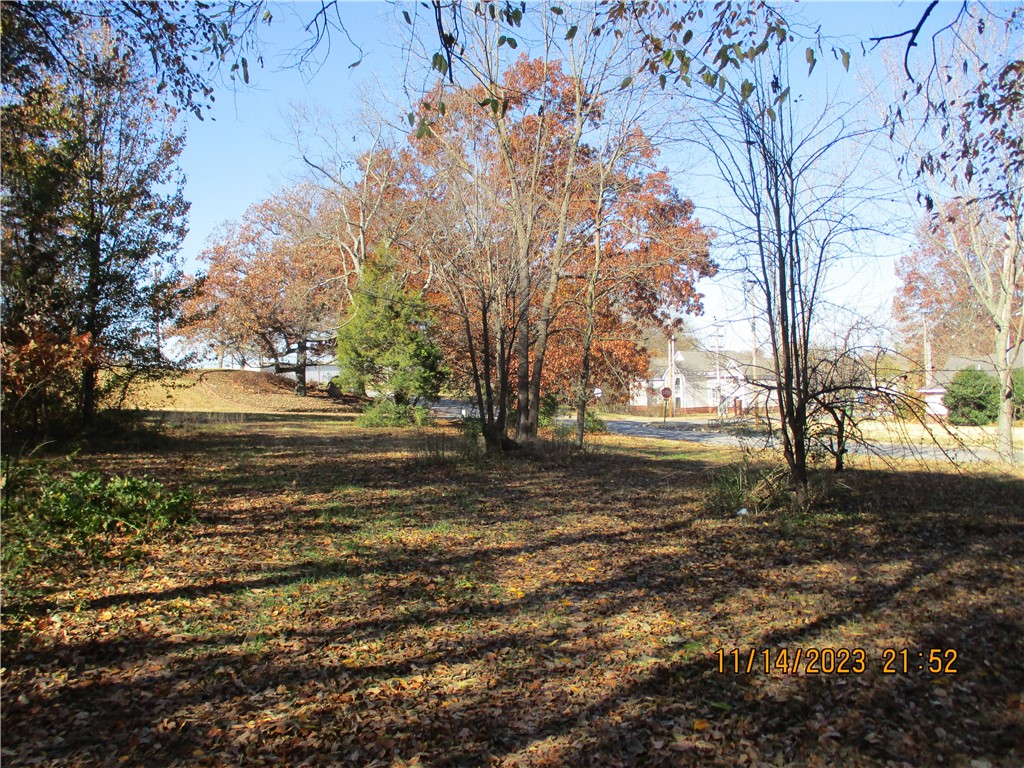 Rare property with a history. Until 2013 the space was occupied by the area Grange Building, built as Oakhill School in Pre-Civil War days. This unique property can be your custom build homesite. Some trees exist and soon to be built, a bike and walking trail will adjoin the property! Fantastic location jut minutes to Downtown Rogers, Lake Atalanta, I-49 or Pinnacle Hills Promenade. The new Walmart Home Office being built now, is only a 12 minute drive. Build where old Rogers still lives on.