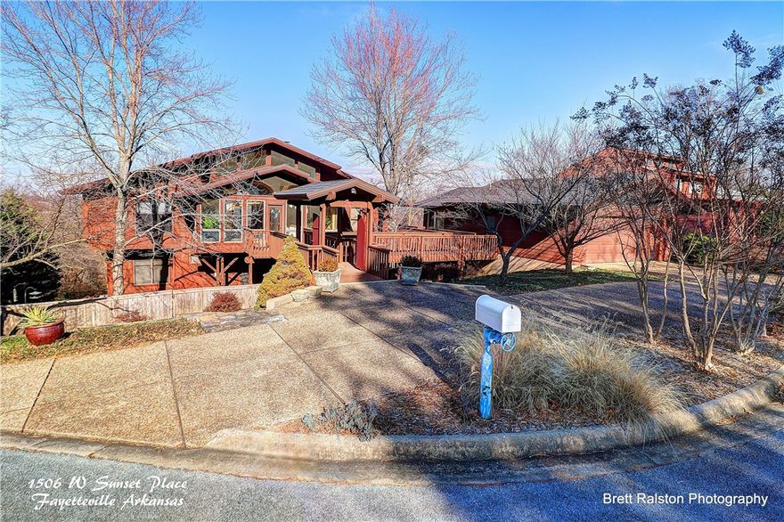 Custom built home within walking distance to University of Arkansas campus! Beautifully designed layout with walk in closets, nice built-ins, custom woodwork, AMAZING VIEWS of NW Fayetteville! Main level has lots of windows, kitchen w/ wood cabinetry, Dining. Powered by wired generator, detached garage with indoor lap pool, gated walkway, lower level has own living quarters, sunroom, & kitchen for guests, kids, or mother in law. Home needs a little TLC and a new owner.  Add this home to your list!!!