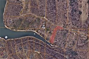 This nearly 1.5-acre lakefront lot offers the perfect setting to build your dream home. Enjoy tranquil lake views and the privacy of spacious land while still having easy access to electric and public water at the street. With plenty of room to create your ideal home, this property is ready for your vision to come to life.