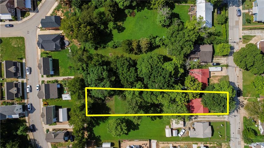 So many possibilities with this ideally located property! Zoned NC (Neighborhood Conservation) and situated within the Walker Park Neighborhood Master Plan, this lot offers outstanding potential just minutes from downtown Fayetteville, the University of Arkansas, Walker Park, and the Razorback Greenway. The property may potentially be split into two lots—each with the option for a single-family home and an accessory dwelling unit (ADU). Think guest house, rental unit, multigenerational suite, or home office—the possibilities are wide open. The existing structure is being sold as is, with the value primarily in the land. A great opportunity for builders, investors, or anyone looking to be part of a growing, vibrant area. Buyer to verify zoning and development potential with the City of Fayetteville. Adjacent property to the south is also available—see MLS 1315540 for details.