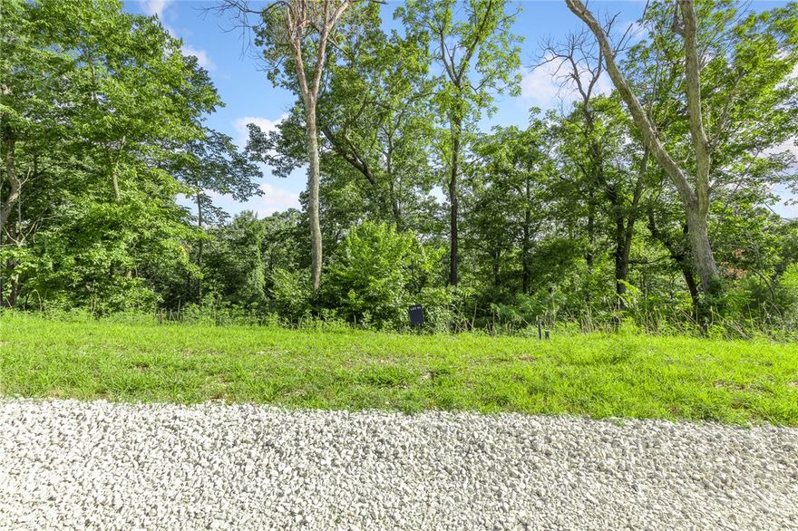 The groundwork is already done for you!  This lot comes fully equipped with underground utilities already in place, including natural gas, fiber optic internet, electric, public water, and sewer. No waiting, no guesswork, no costly setup—just a smooth, ready-to-build opportunity from day one.  Lot 91 (0.80 m/l ac) of Round Mountain Estates is a wooded lot that sits on the lower section of the development. Restore Ridge provides the seclusion you have been wanting.  RME is the newest subdivision in Harrison, AR. If you’ve been dreaming of trading city lights for star-filled skies, RME delivers. Beyond your homesite, you’ll have access to a 350 acre common area reserved for residents, featuring a stocked fishing pond, Kissing Rock Trail, natural springs, Baby Canyon Trail, striking bluff lines and views that stretch for miles.  *Terrapin Creek Rd will be paved in the future, per county officials.