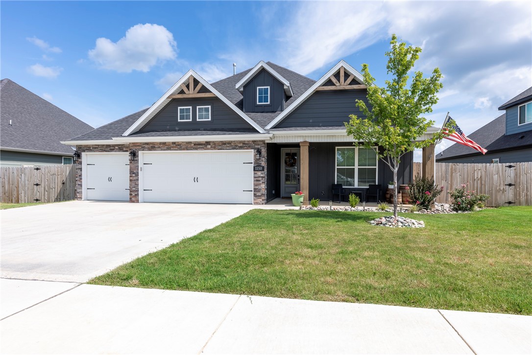 Discover the charm of modern living in our exquisite 2-story home located in the Maple Estates of Centerton, AR. This 2022-build is within walking distance from Centerton Gamble Elementary and Bentonville West High School. This rental home features 4 bedrooms, 3.5 bathrooms, and a 3-car garage. The ground floor showcases new hardwood floors throughout, complemented by an open-plan living area with cathedral ceilings and wood beams. At the heart of this home is the expansive kitchen with island, equipped with gas range, SS fridge, dishwasher and microwave. The primary suite and an additional bedroom are on the main level, while two more bedrooms are situated upstairs with new carpet, along with substantial attic storage. The upper foyer is a cozy retreat, complete with built-in bookshelves. Enjoy quiet times on the large covered patio with fireplace and TV hook ups. Backyard is completely fenced. You will have access to the neighborhood pool for those hot days.
