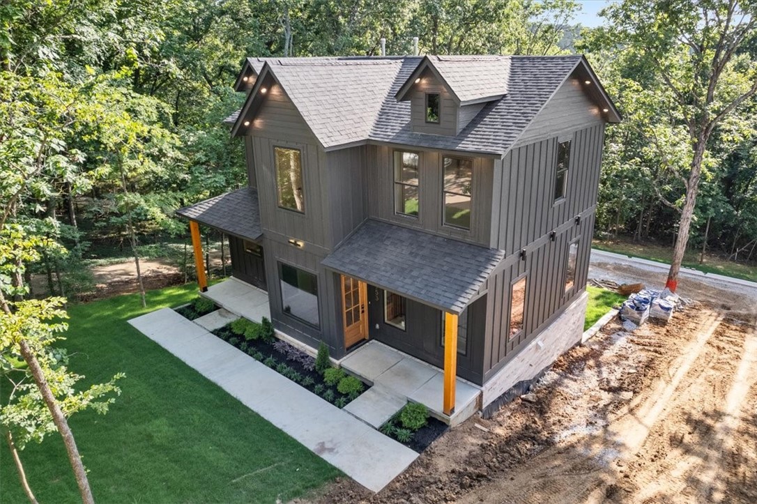Gorgeous new construction home in the center of Fayetteville close to the University of Arkansas and connected by sidewalks to trail systems. Enjoy four bedrooms each with an ensuite bathroom and tiled walk-in showers. Dual master bedrooms. Luxury features throughout the home including Delta fixtures and Frigidaire Professional appliances. Each floor is independently zoned with dedicated HVAC and insulated floors for sound proofing. Beautiful wood floors installed with premium carpet scheduled for installation soon. Walkout basement includes oversized two car garage and extra large driveway capable of hosting your visitors on game day weekends. Backyard is wooded on three sides with sunset views from WeatherBarr tinted windows. Deer are regular visitors. Two similar homes are also for sale next door.