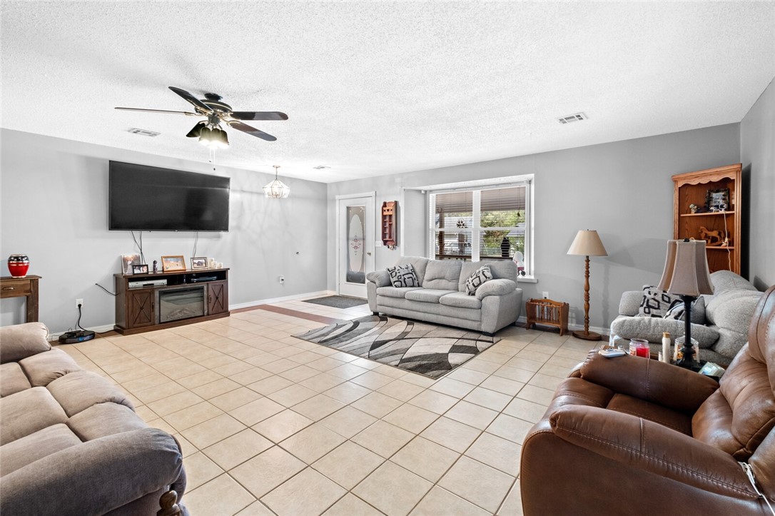 Welcome to this spacious 2,421 sq. ft. residence, perfectly situated on a large corner lot in the heart of Gravette. This inviting home features four well-appointed bedrooms and two and a half baths, offering ample space for families of all sizes. The master bedroom is a true retreat, providing a peaceful haven with enough space for a cozy sitting area. The adjoining master bath features plenty of storage, ensuring both comfort and convenience. The home's layout is functional and versatile, with three additional bedrooms that can easily adapt to your family’s needs, whether as guest rooms, home offices, or playrooms. Don’t miss the opportunity to make this charming Gravette home your own!
