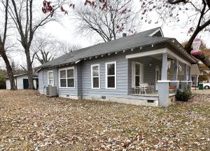 Fall in love at first sight!! From your first steps onto this beautiful covered porch, this one of a kind home features over 9' ceilings, wood & tile floors, a huge kitchen, and an oversized city lot...all close to Arkansas Tech, and local employers. Plenty of room outside for the entire family, and out buildings for storage and/or workshop.